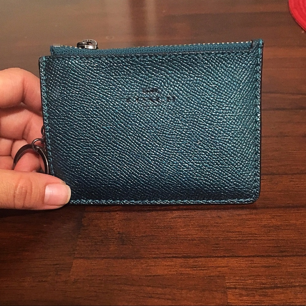 Forest green metallic Coach wristlet